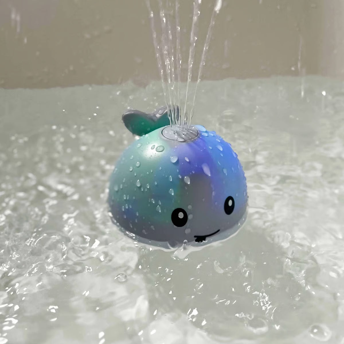 Water-Activated Glowing Sprayer Toy ~ Light-up bath fun with instant fountain play.