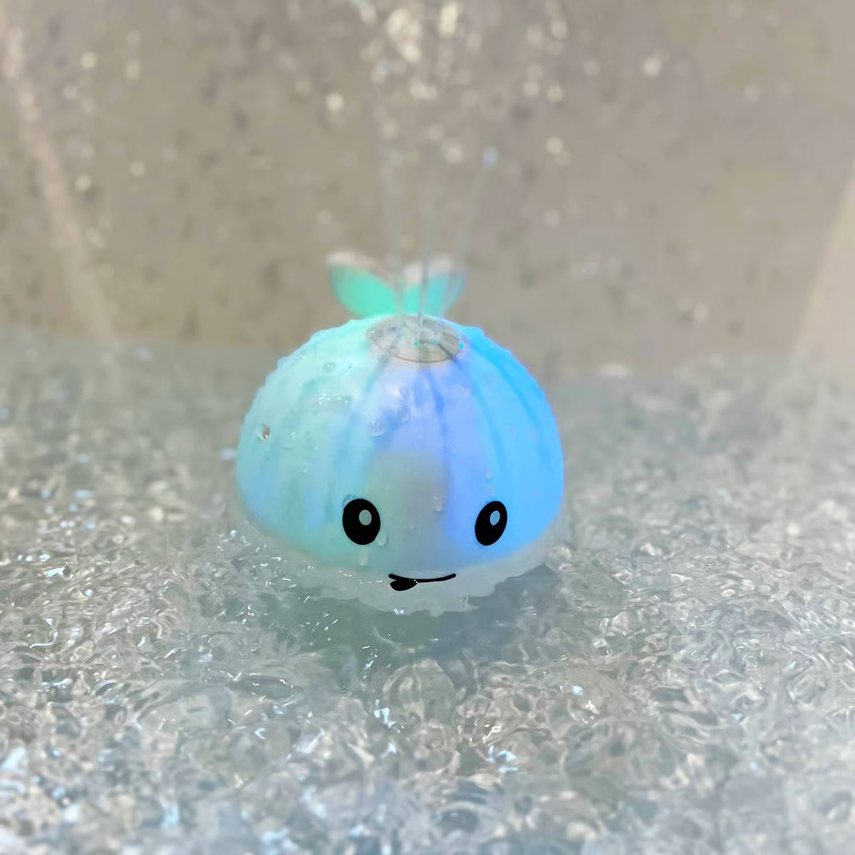 Water-Activated Glowing Sprayer Toy ~ Light-up bath fun with instant fountain play.