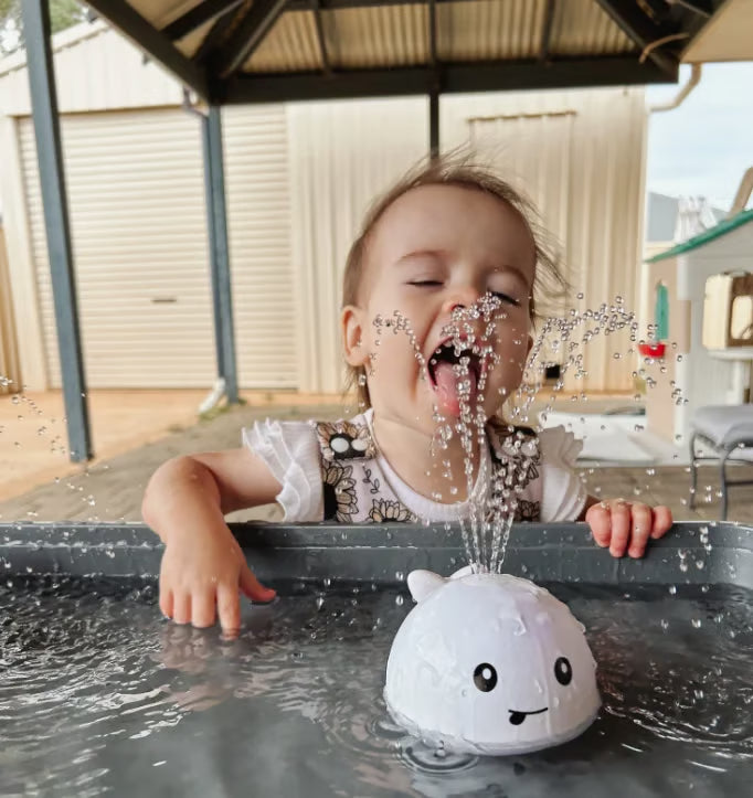 Water-Activated Glowing Sprayer Toy ~ Light-up bath fun with instant fountain play.
